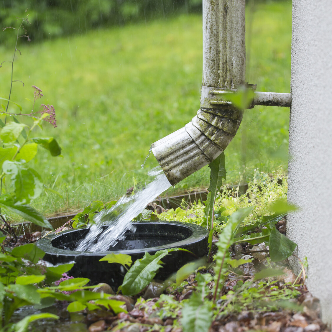 gutter pipe spraying water