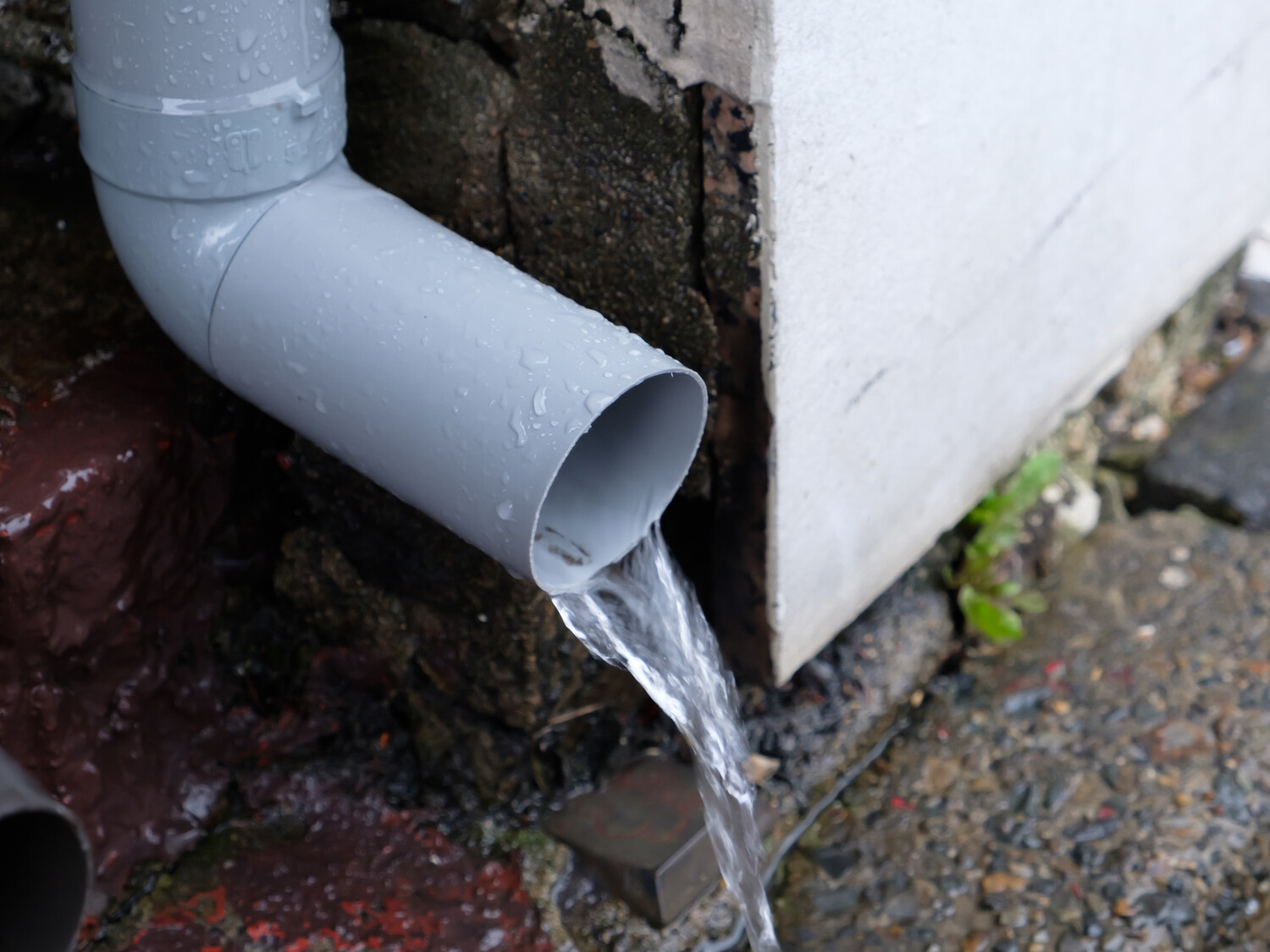 water spout directing yard drainage residential property mikula contracting