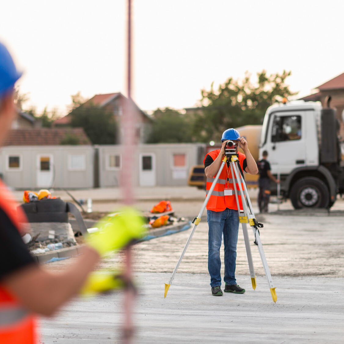 Surveyors on construction site demolition preparation mikula contracting home projects