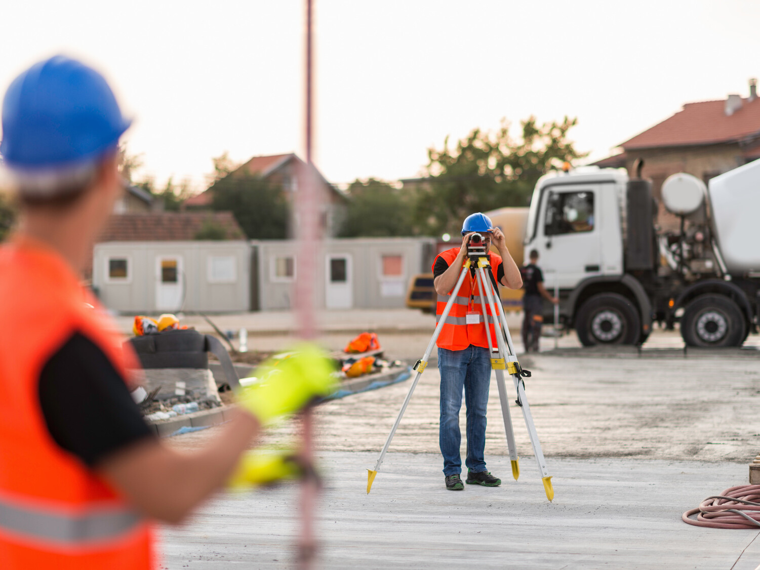 Surveyors on construction site demolition preparation mikula contracting home projects