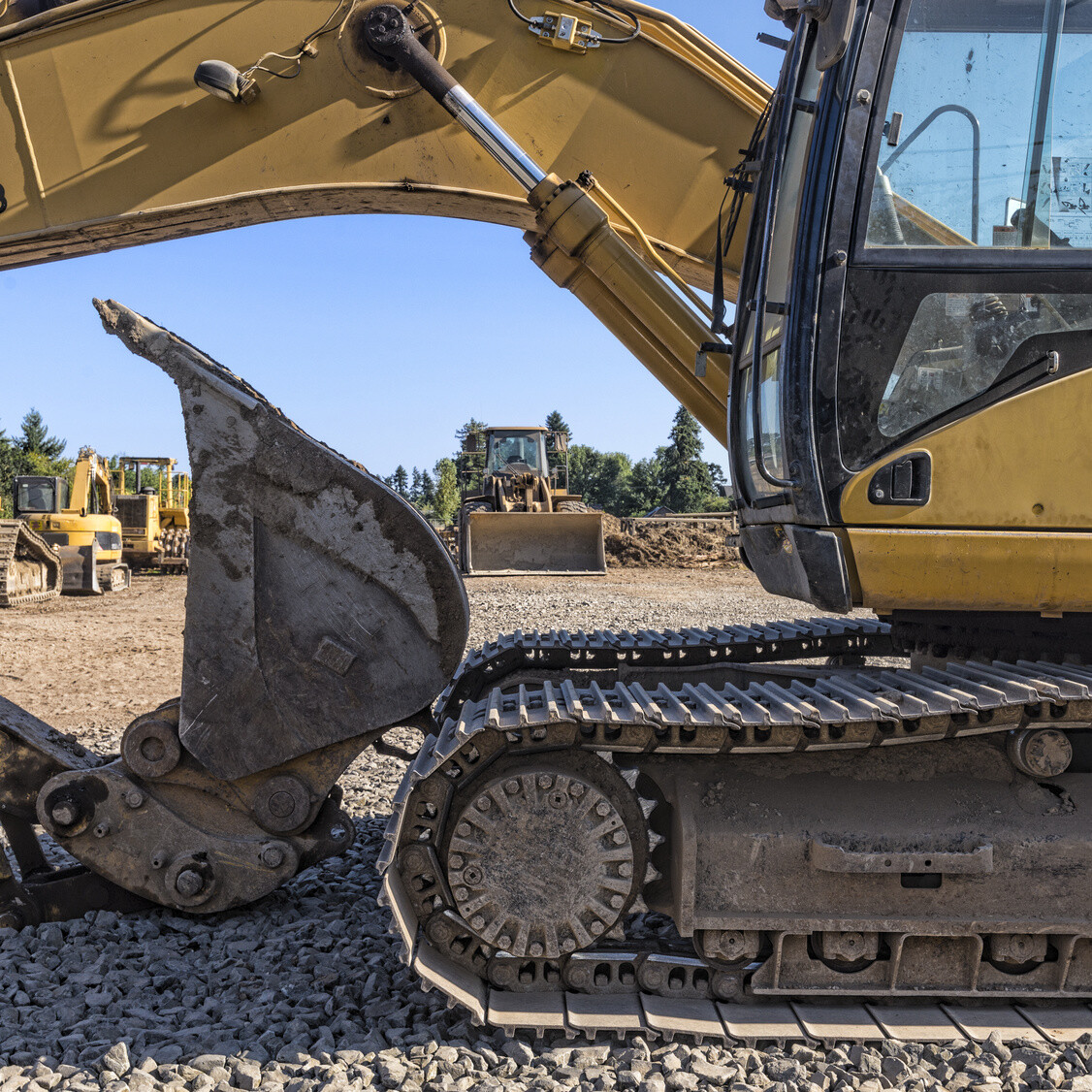 Heavy equipment is seen behind a backhoe