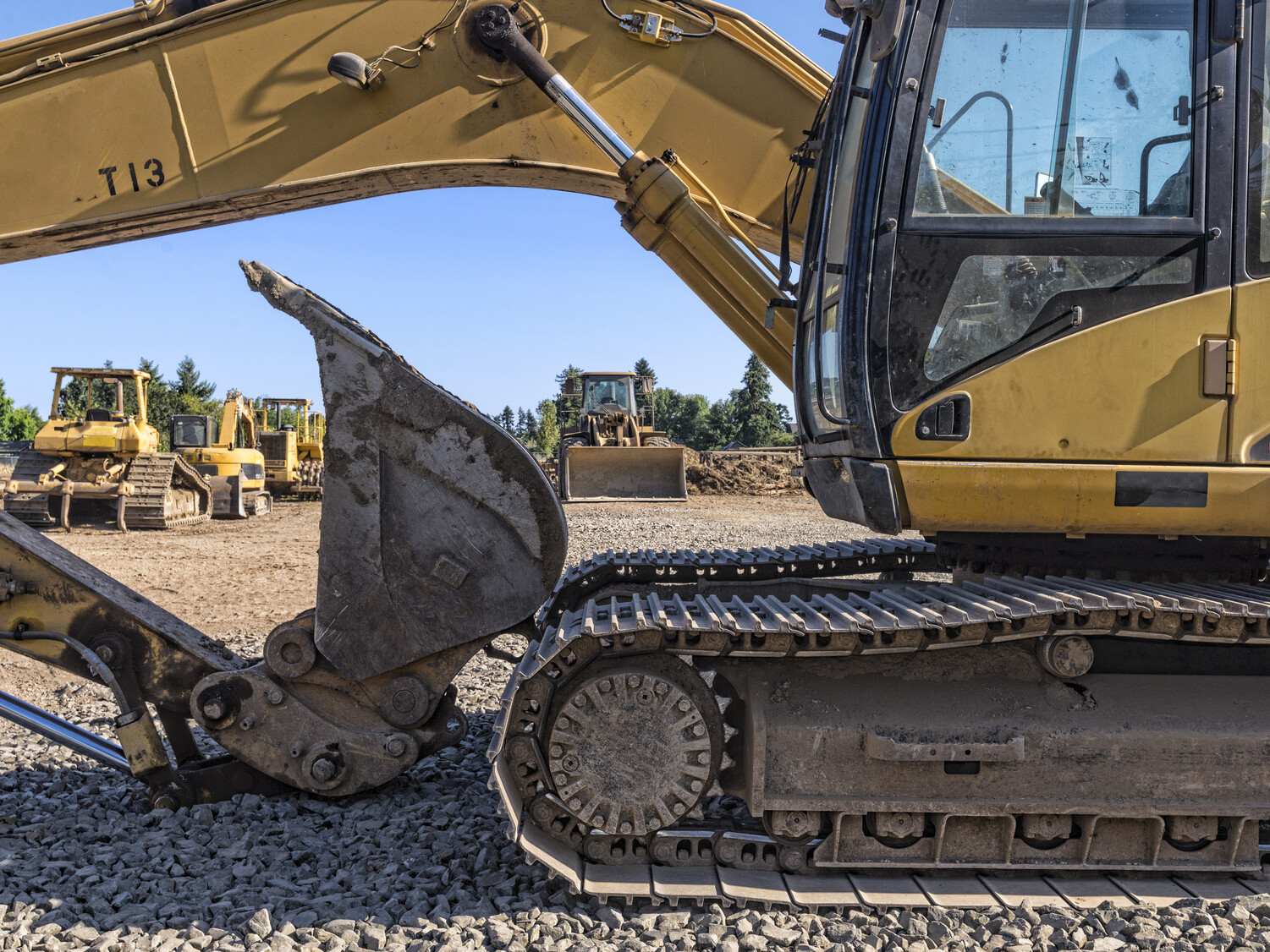 Heavy equipment is seen behind a backhoe
