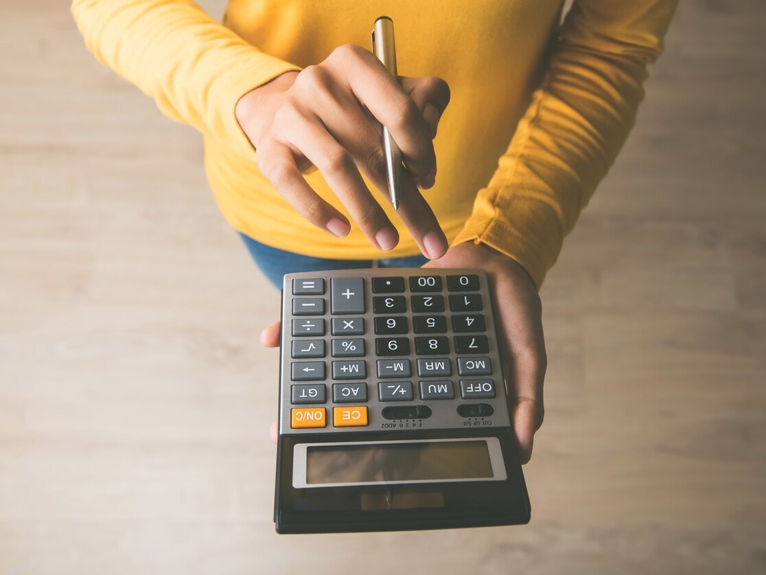 woman using calculator for excavation estimate