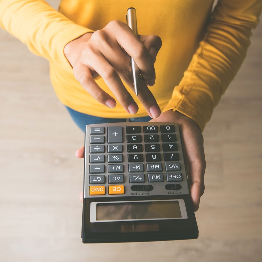 woman using calculator for excavation estimate