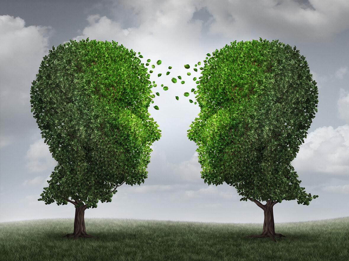 Two trees shaped like heads facing each other