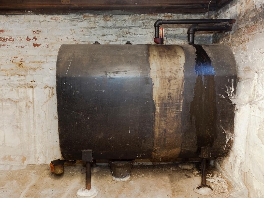 old oil tank in residential home basement