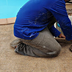 worker doing commercial pool removal