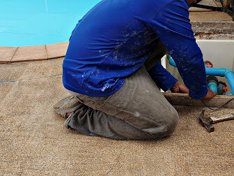 worker doing commercial pool removal