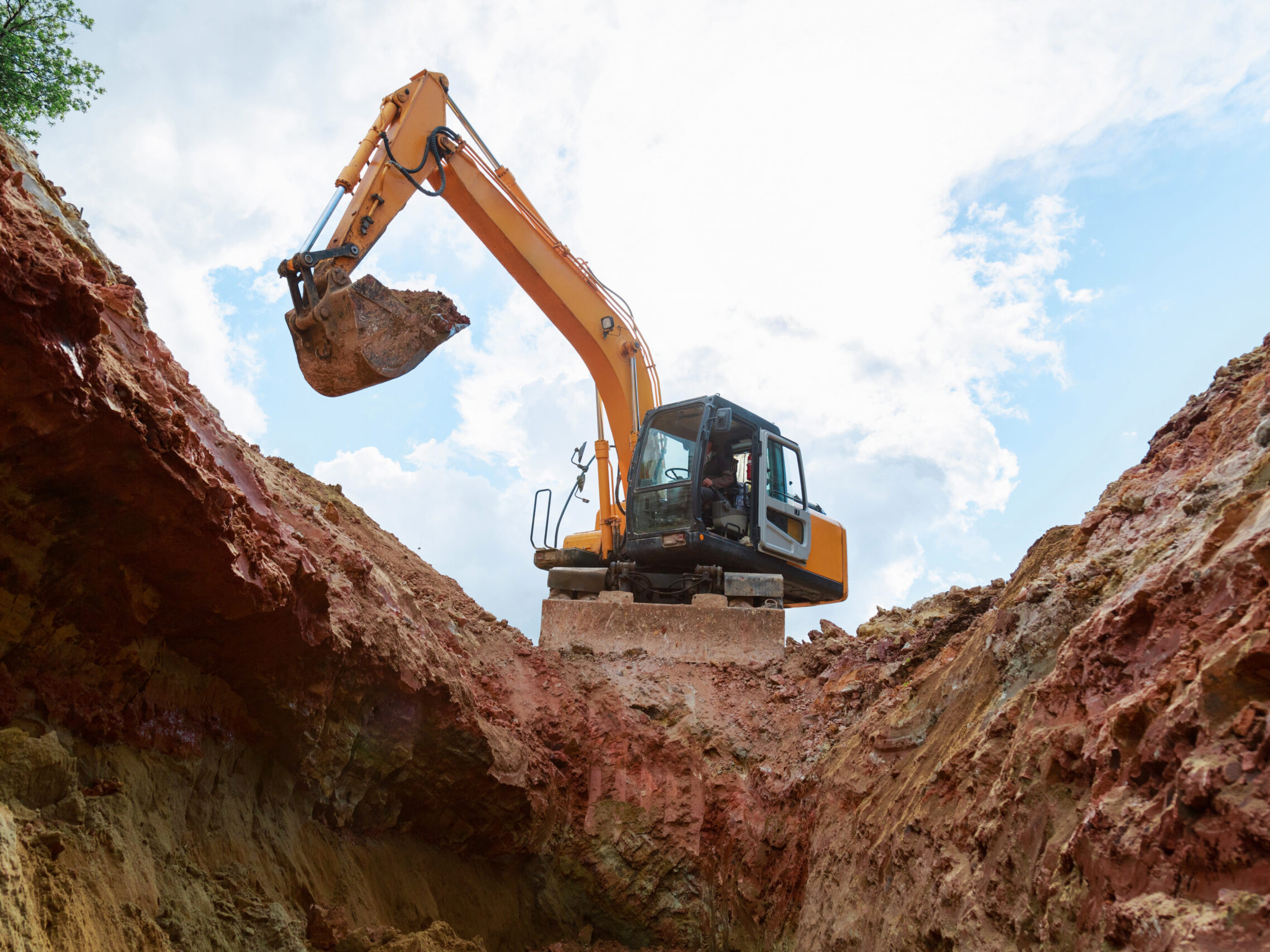 Excavator Digging Into A Construction Site