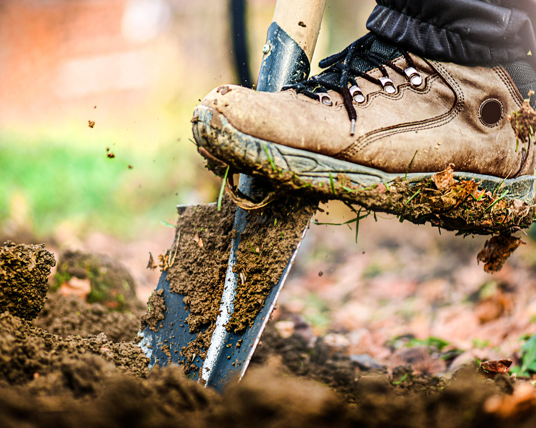 picture of a shovel breaking ground while digging a foundation