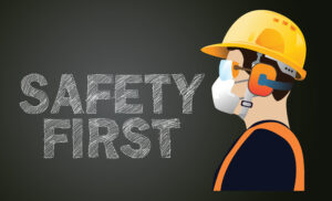 the words safety first with a man in construction safety gear