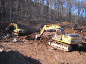 Contractor clearing land with an excavator.