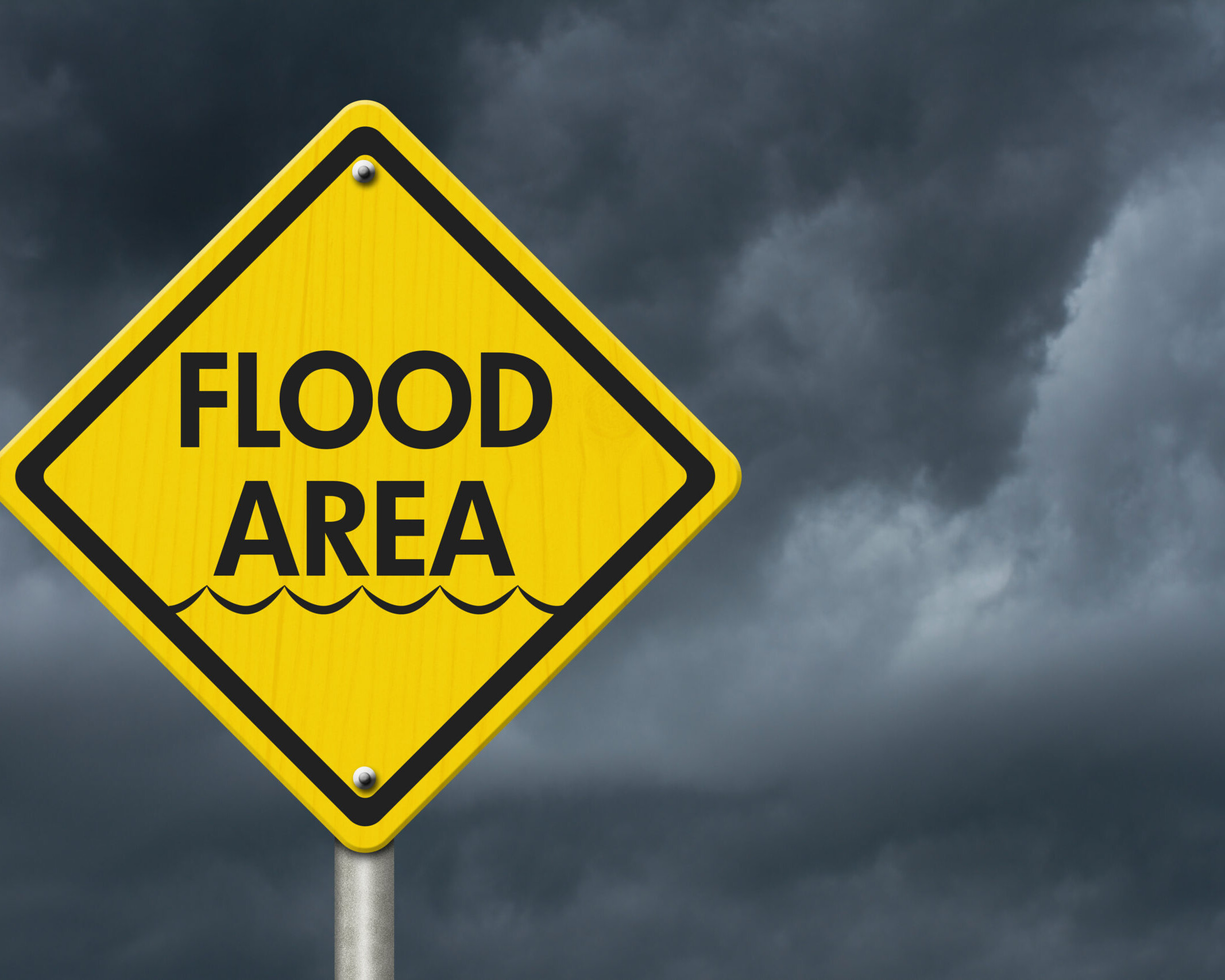 Yellow Warning Flood Area Highway Road Sign, Red, Yellow Warning Highway Sign with words Flood Area with stormy sky background