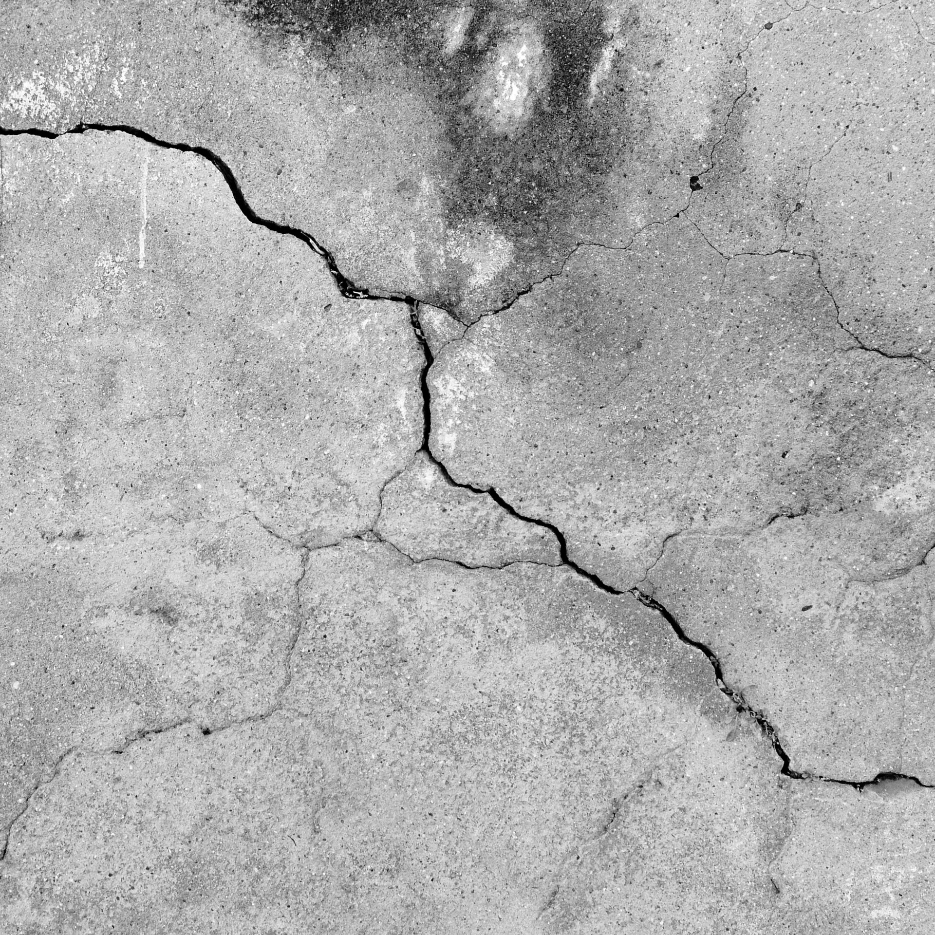 Grunge concrete cement wall with crack in industrial building