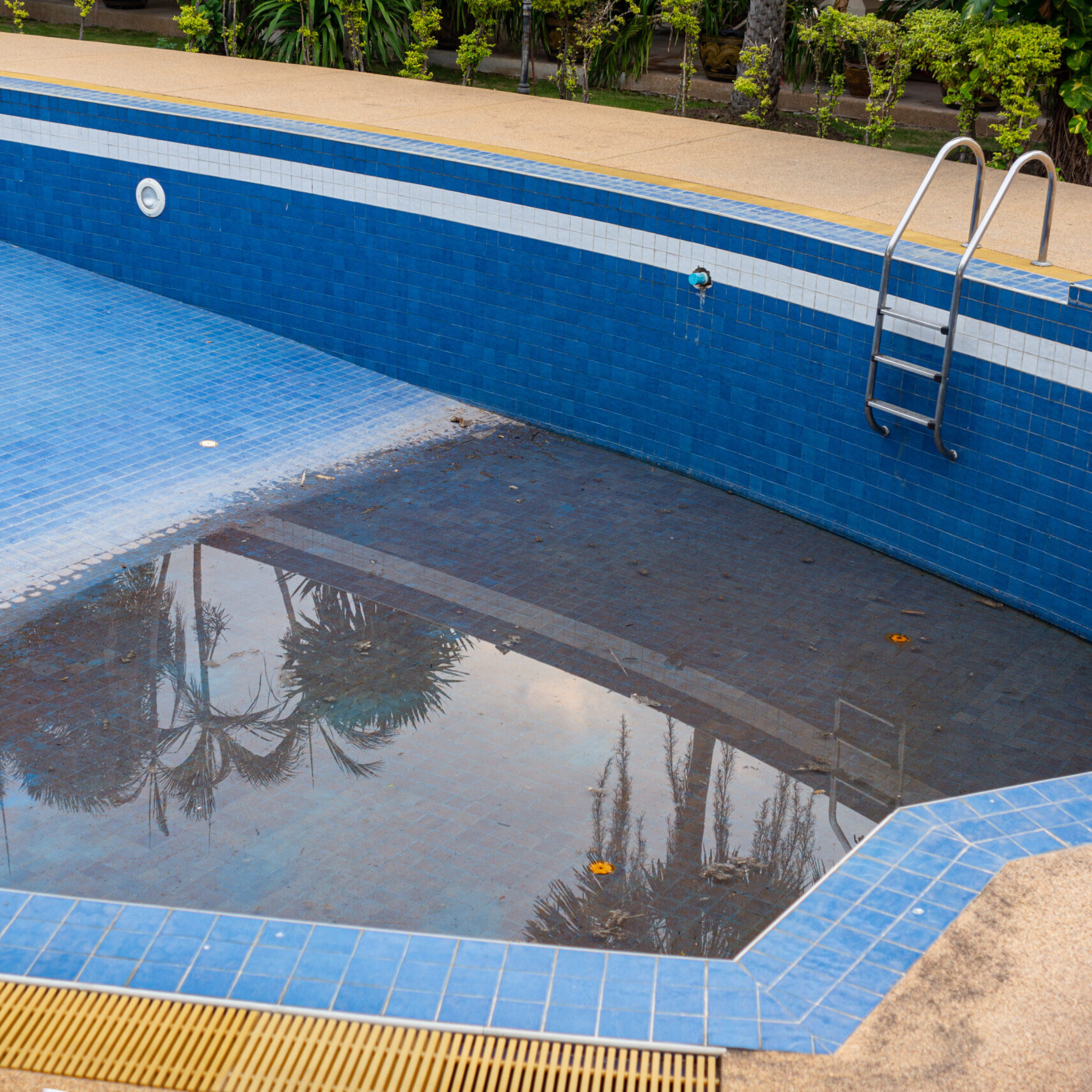old and abandoned swimming pool ready for removal