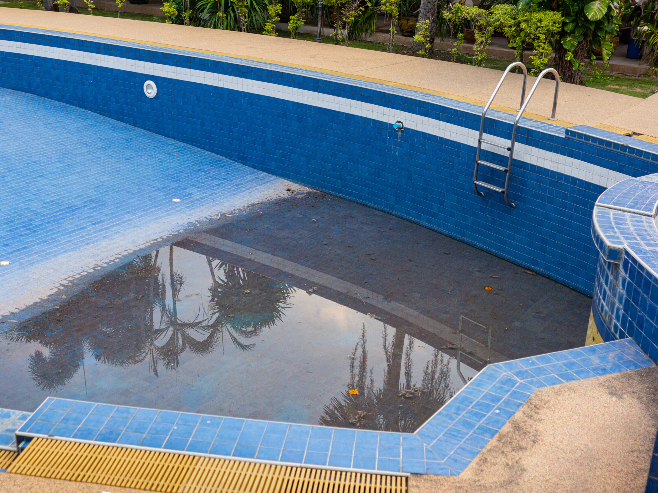old and abandoned swimming pool ready for removal