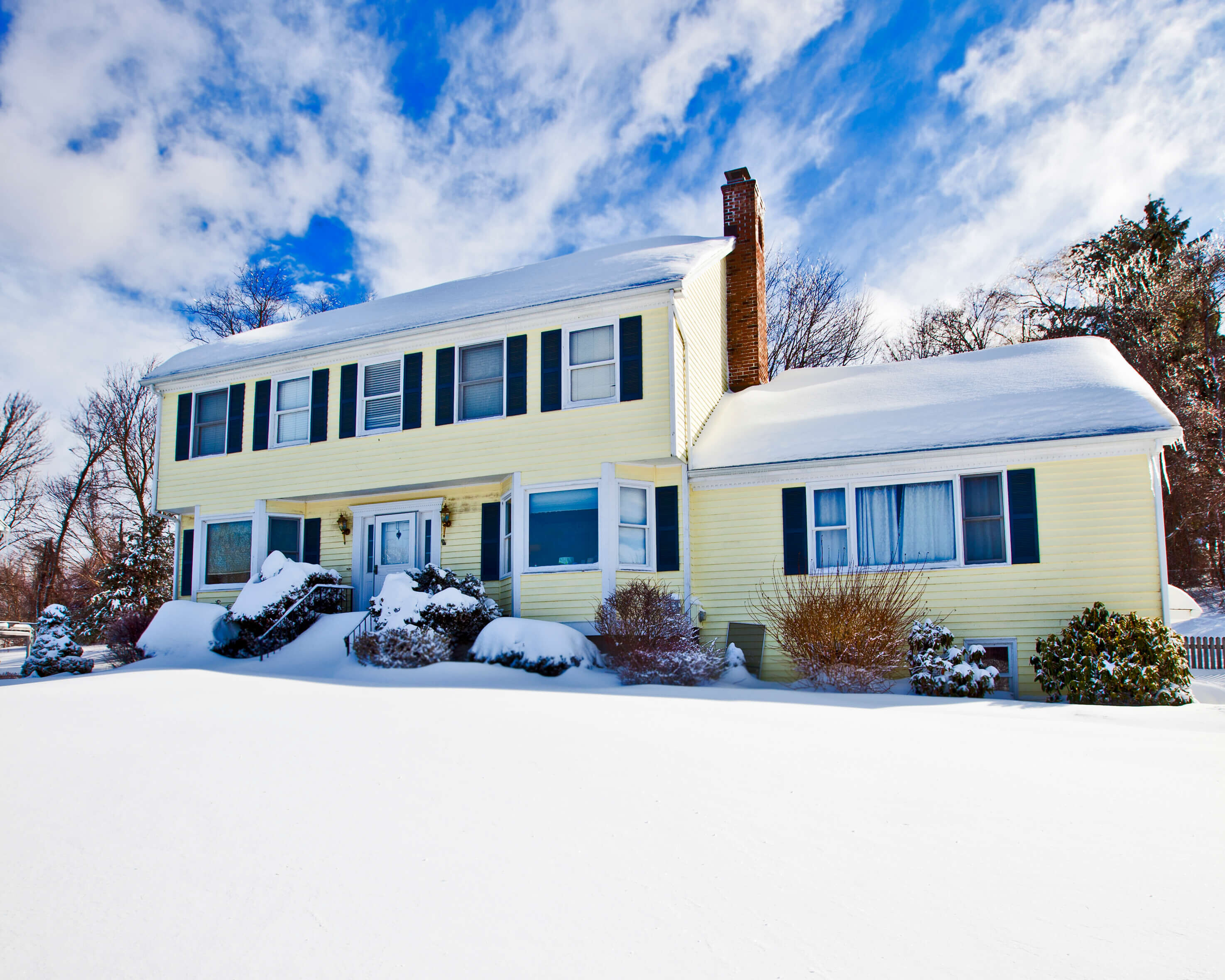 New Jersey home with snow around its foundation needing proper drainage