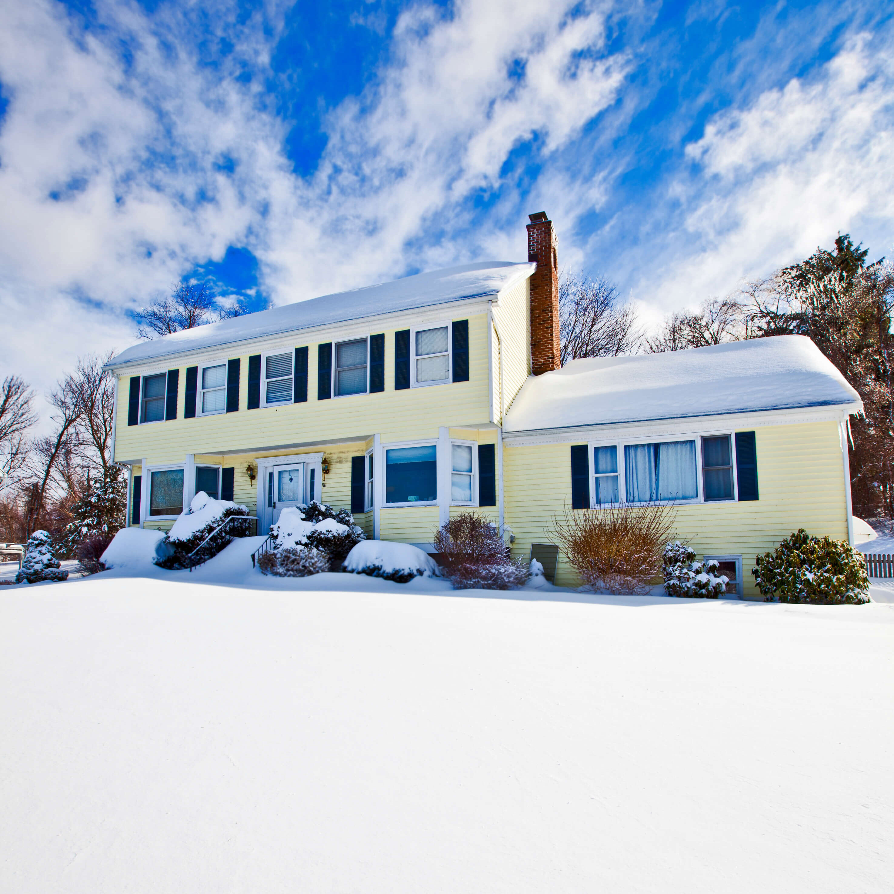 New Jersey home with snow around its foundation needing proper drainage