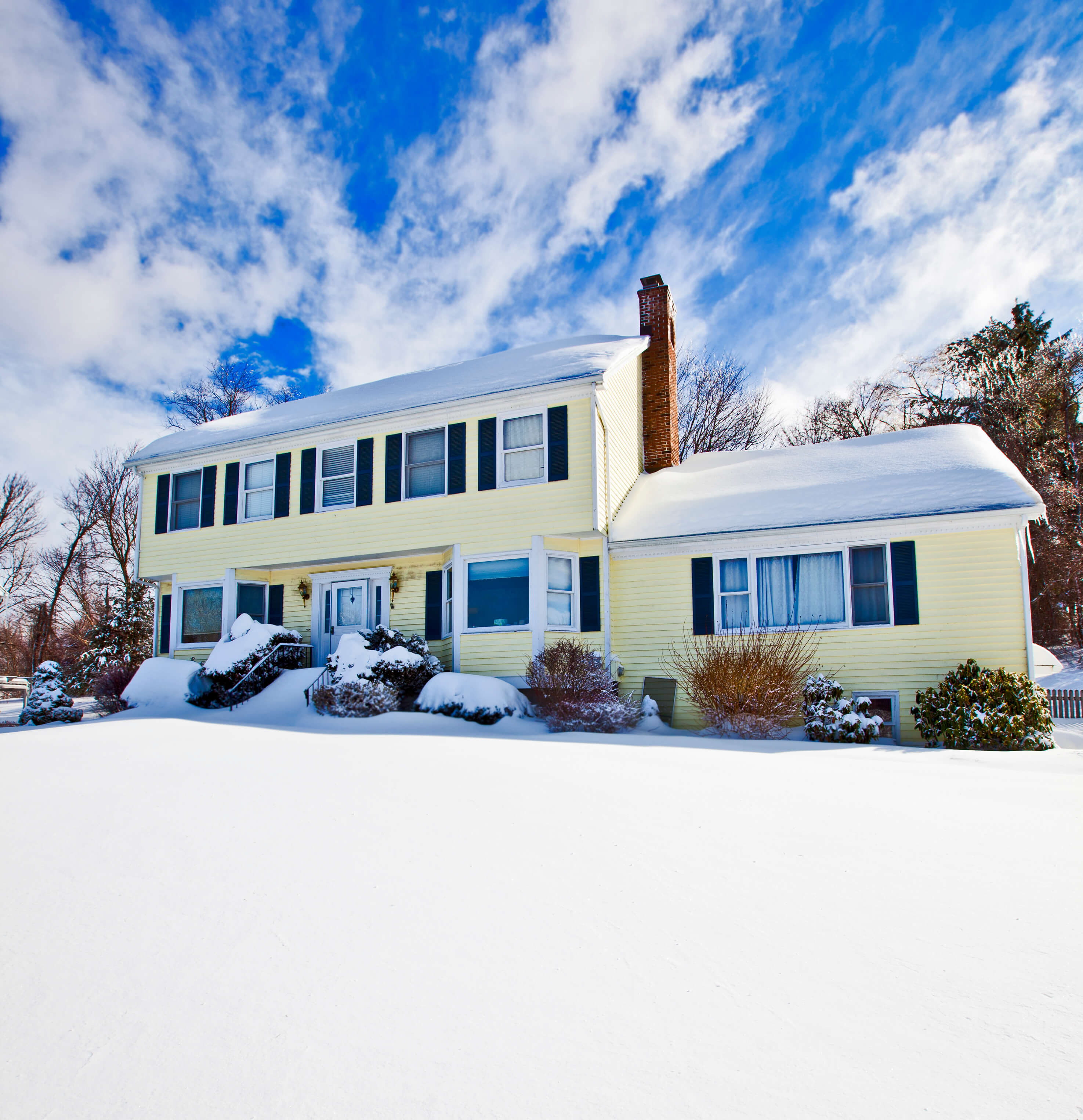 New Jersey home with snow around its foundation needing proper drainage