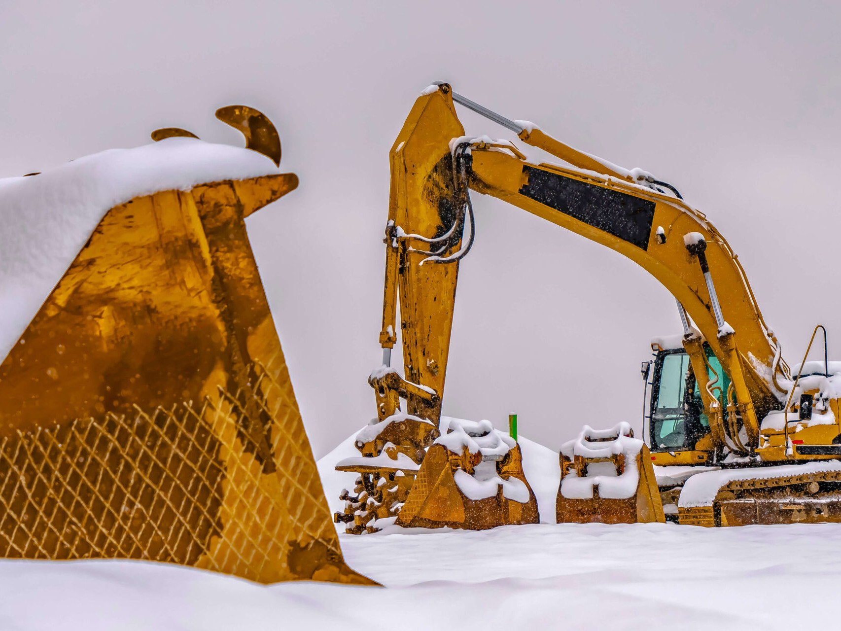 Land improvement contractor working in the snow